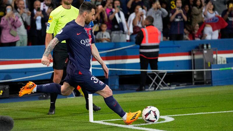 PSG's Lionel Messi kicks a corner shot during the French League One soccer match between Paris...