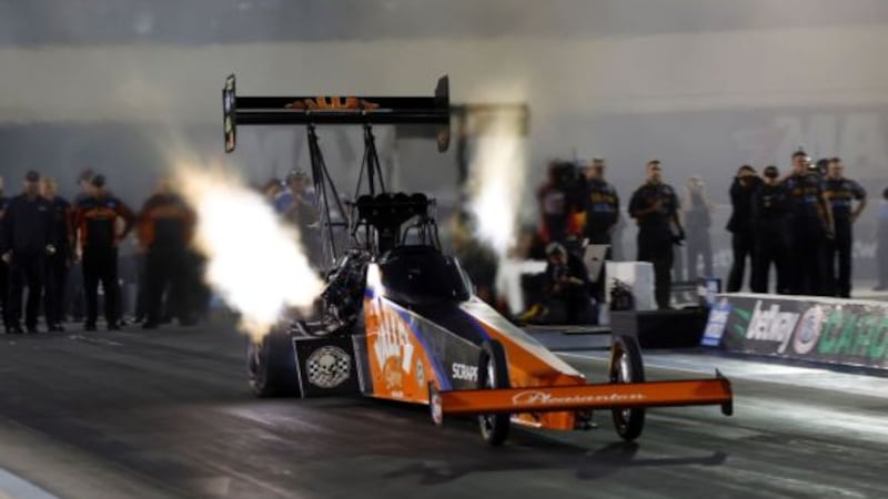 Top Fuel driver Mike Salinas raced to the first-ever 300 mph eighth-mile pass en route to...