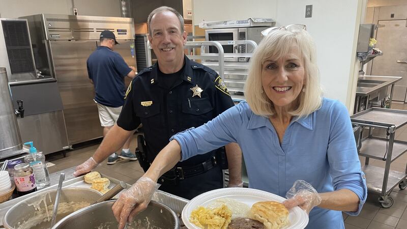 CUFF founder Debra Yokley and Captain Mark McDaniel of the Rowan Sheriff's office served up...
