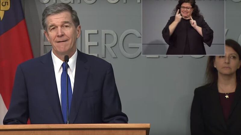Roy Cooper speaks at a press conference on the state's COVID-19 response as NCDHHS Sec. Mandy...
