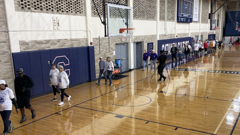 Rain on Saturday morning moved the event inside Goodman gymnasium where attendees walked laps...
