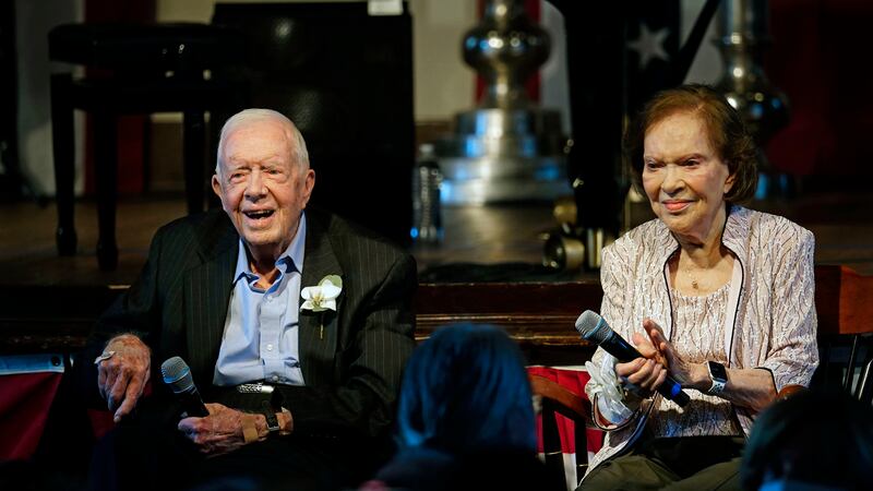 FILE - Former President Jimmy Carter and his wife former first lady Rosalynn Carter sit...