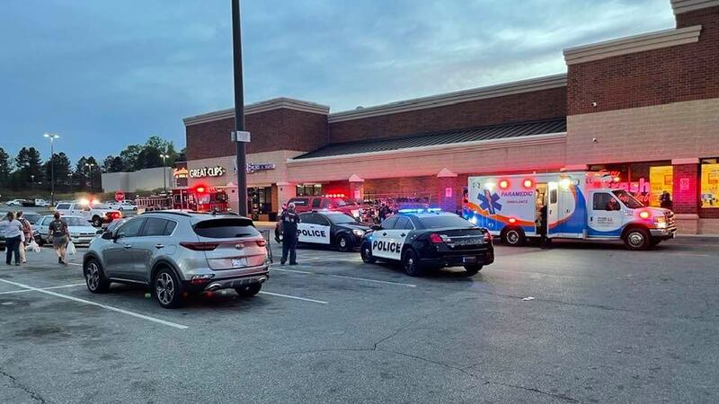 A witness said shoppers hurried out of the store after hearing the gun shot.